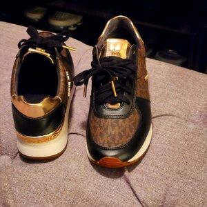 Michael Kors sneakers, 6 1/2 worn once tried on at home. Look new